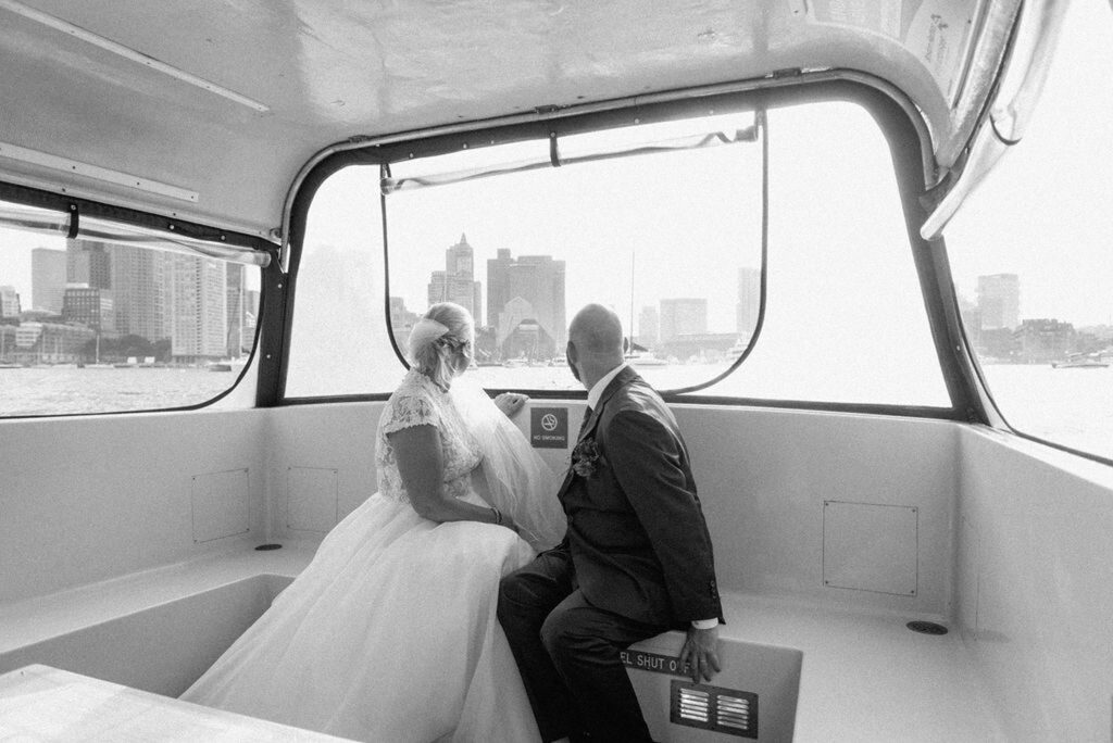 Bride and groom taking water taxi to their Hyatt Regency Boston Harbor Wedding