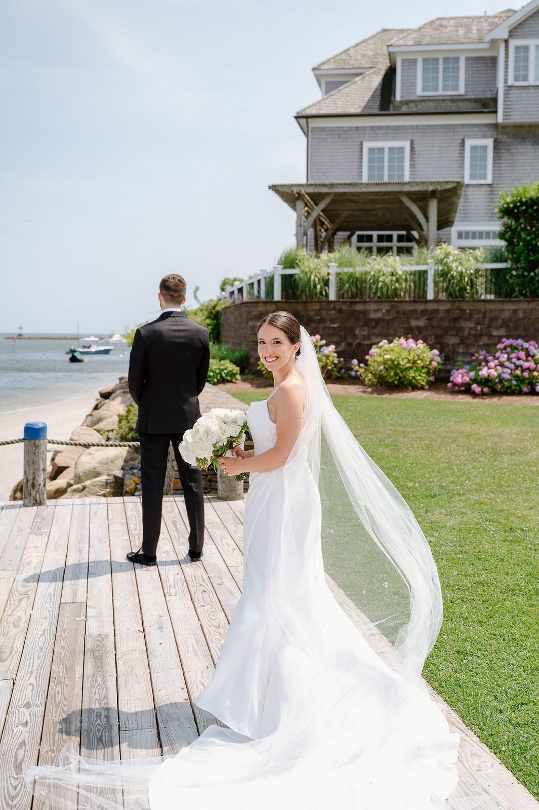 the bride approaching her husband during their first look, planned part of their wedding timeline. 