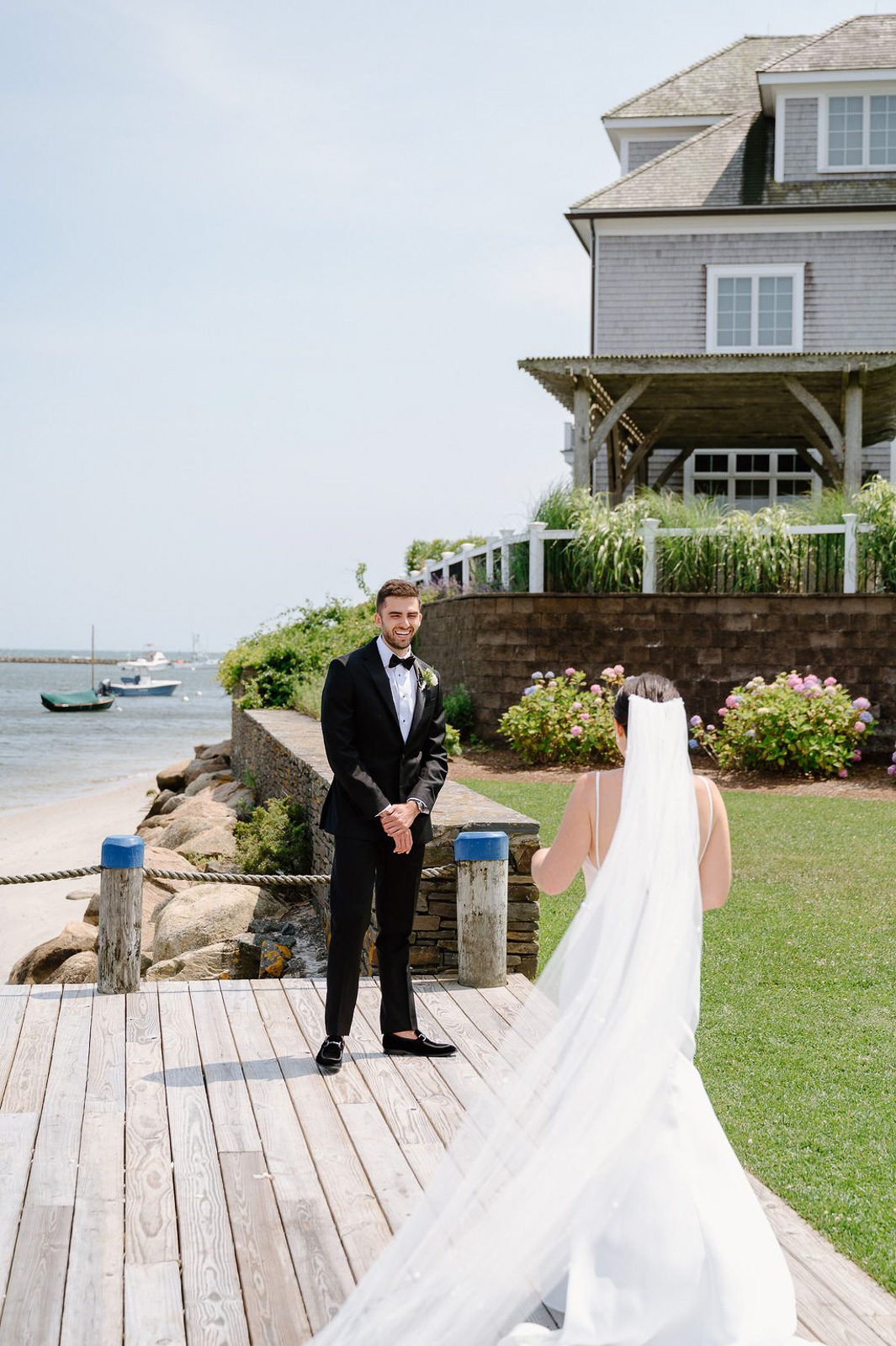 groom admiring his wife during their first look, planned as part of their wedding timeline. 