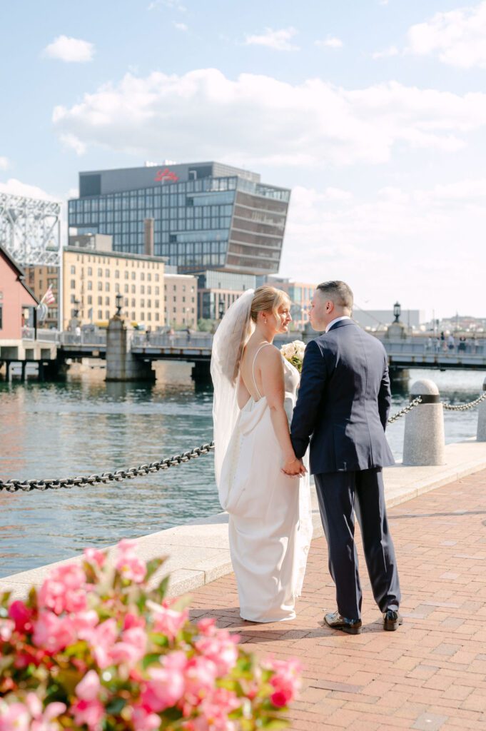 Couple walking on Boston Harbor Walk
