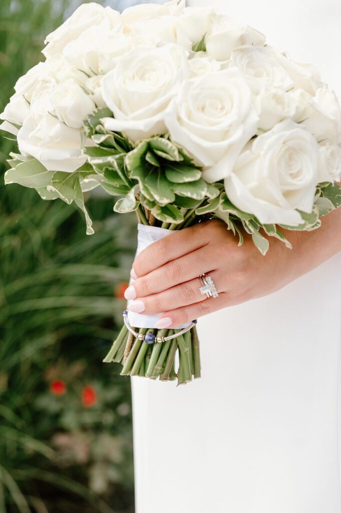 Close up of bridal bouquet and wedding ring details