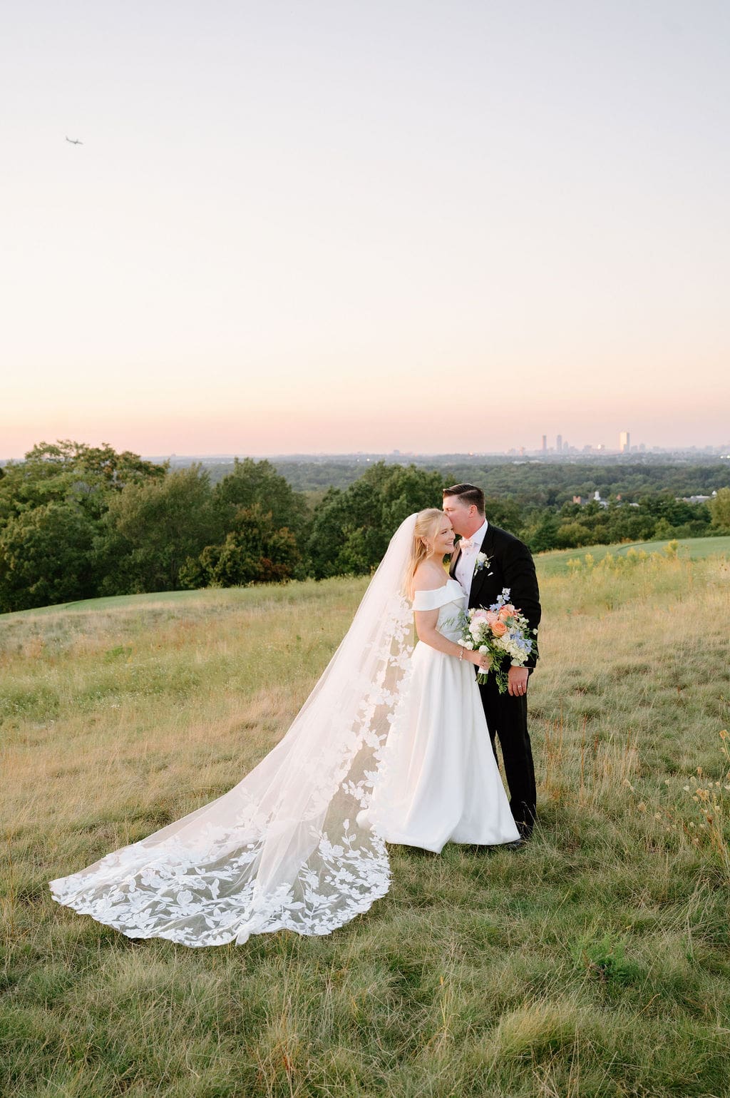 Sunset wedding portraits at Granite Links overlooking Boston skyline