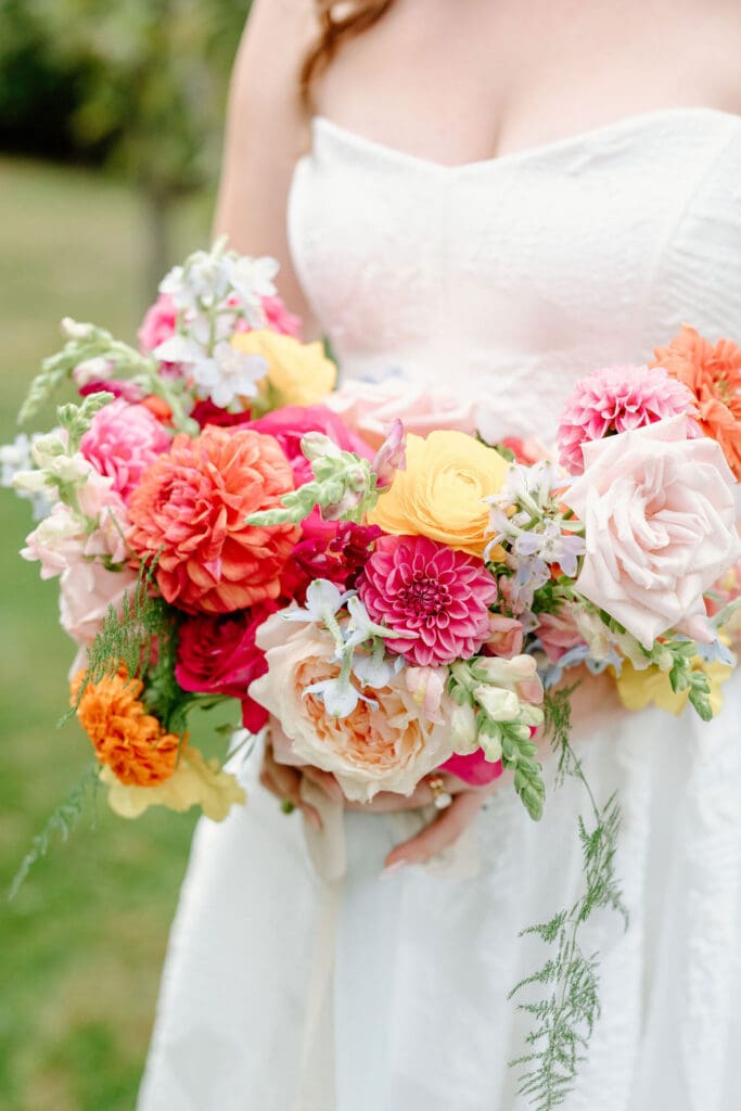 Bright floral arrangements at vineyard wedding in Derry NH