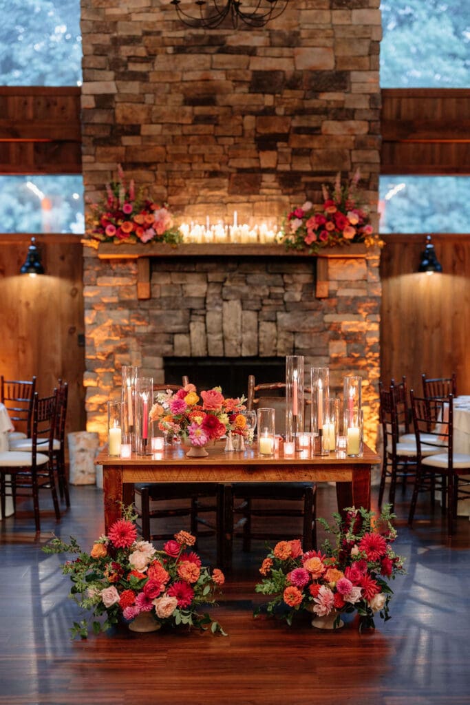 Reception table details with candles and florals at vineyard wedding