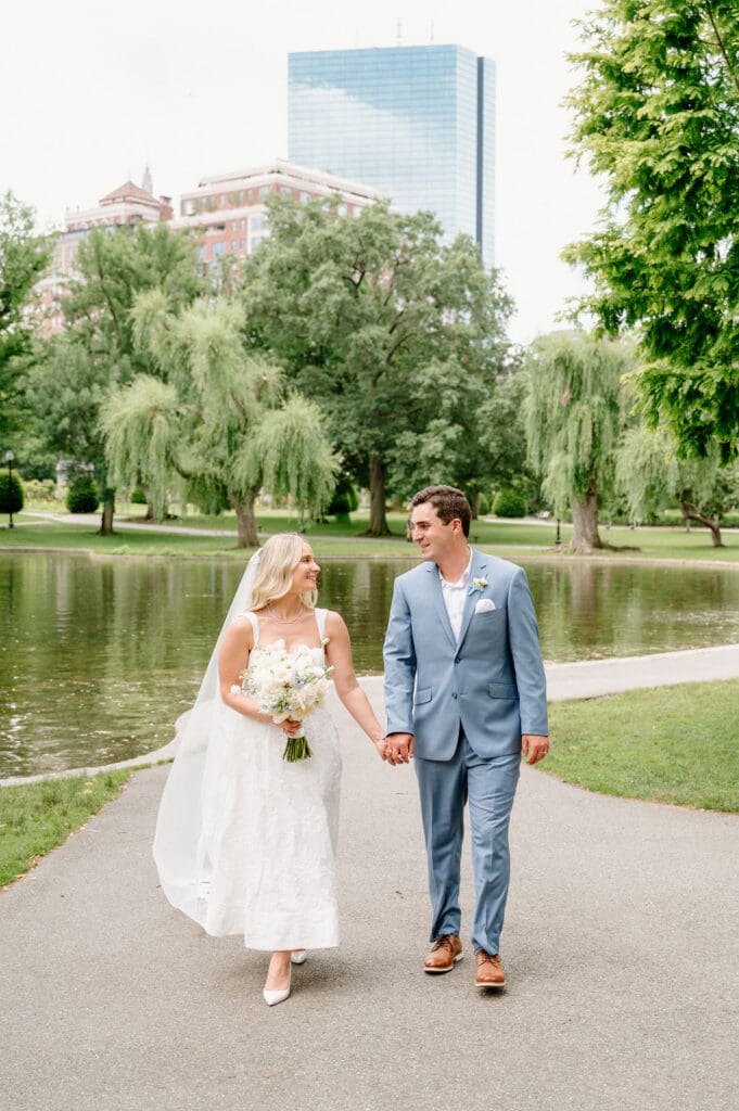 Couple walking through the Boston Public Garden