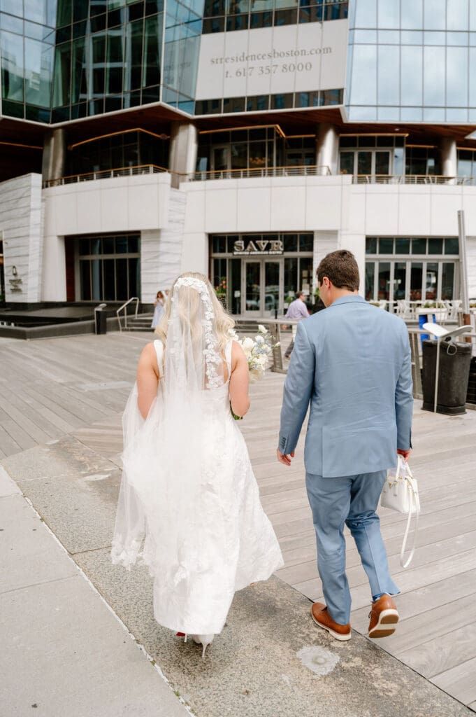 Couple celebrating their Boston City Hall wedding over lunch