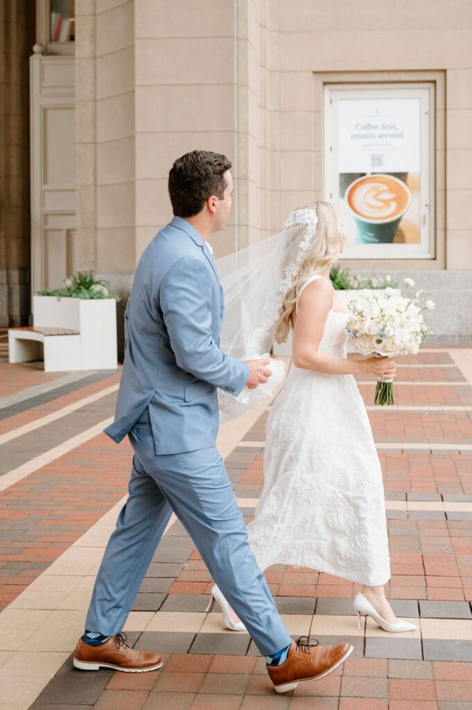 Couple walking outside Boston City Hall